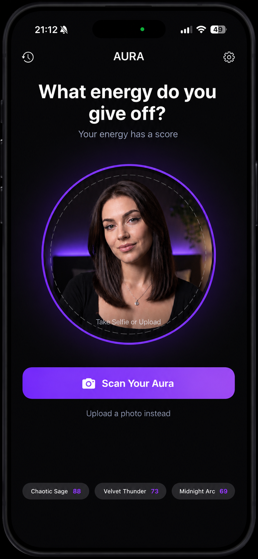 AURA scan screen on iPhone asking what energy do you give off, with a portrait in the circular scan area and a Scan Your Aura button